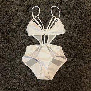 Very cute white, one piece swimsuit.
